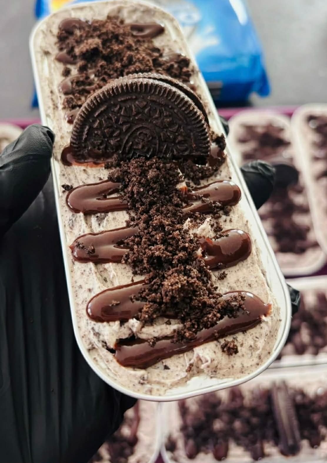 Cookies and cream mini dessert with Oreo cookie and chocolate drizzle
